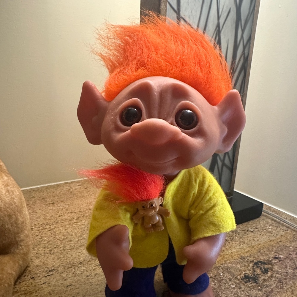 Original vintage Troll; pointed ears & yellow/blue attire.